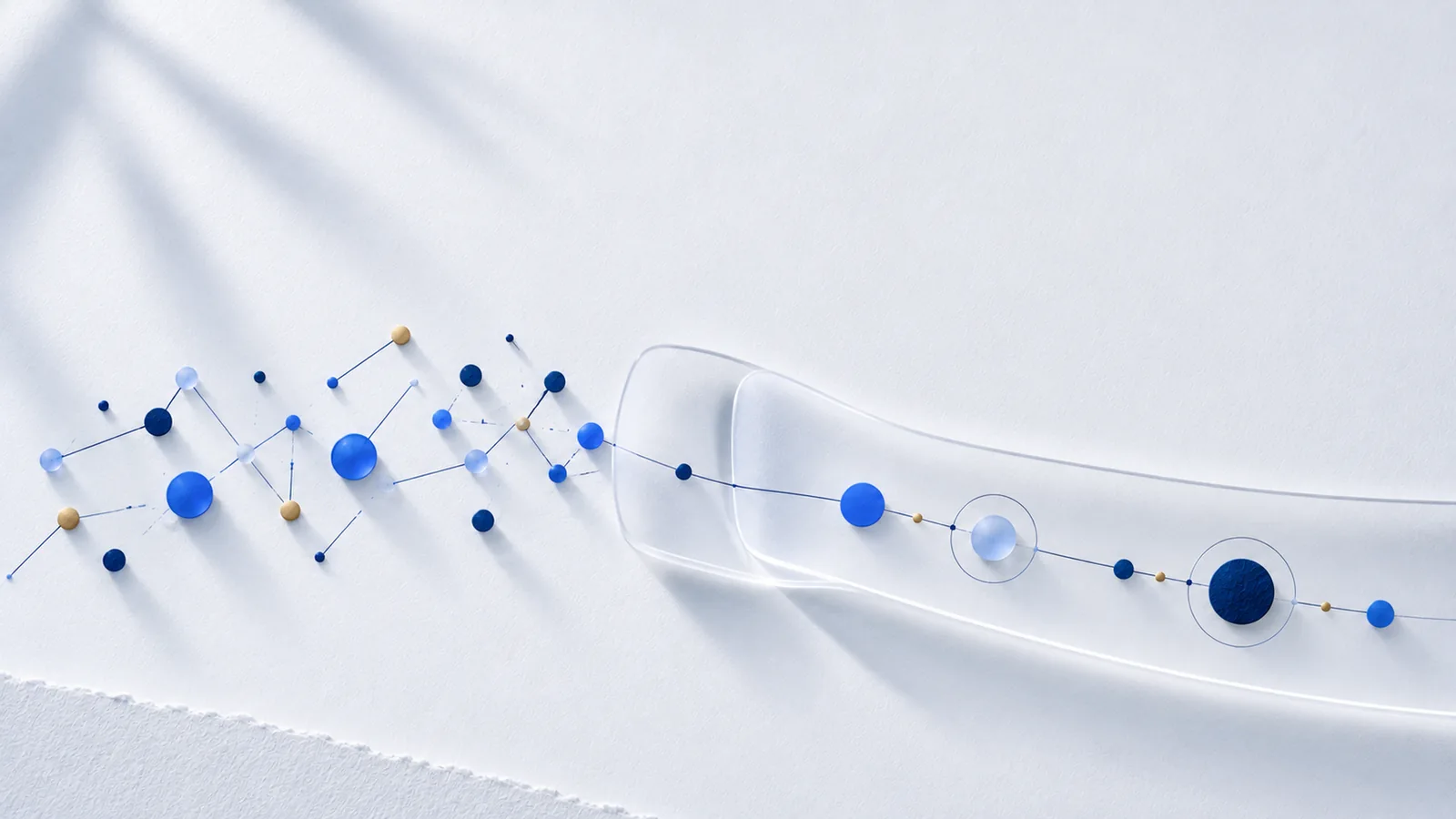 On the left a disordered network of blue, dark and golden dots; on the right a glass channel leads the dots into an ordered line